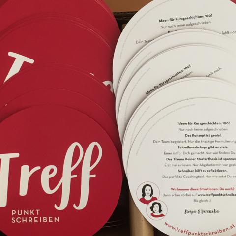 roter, runder flyer mit der aufschrift treffpunkt schreiben